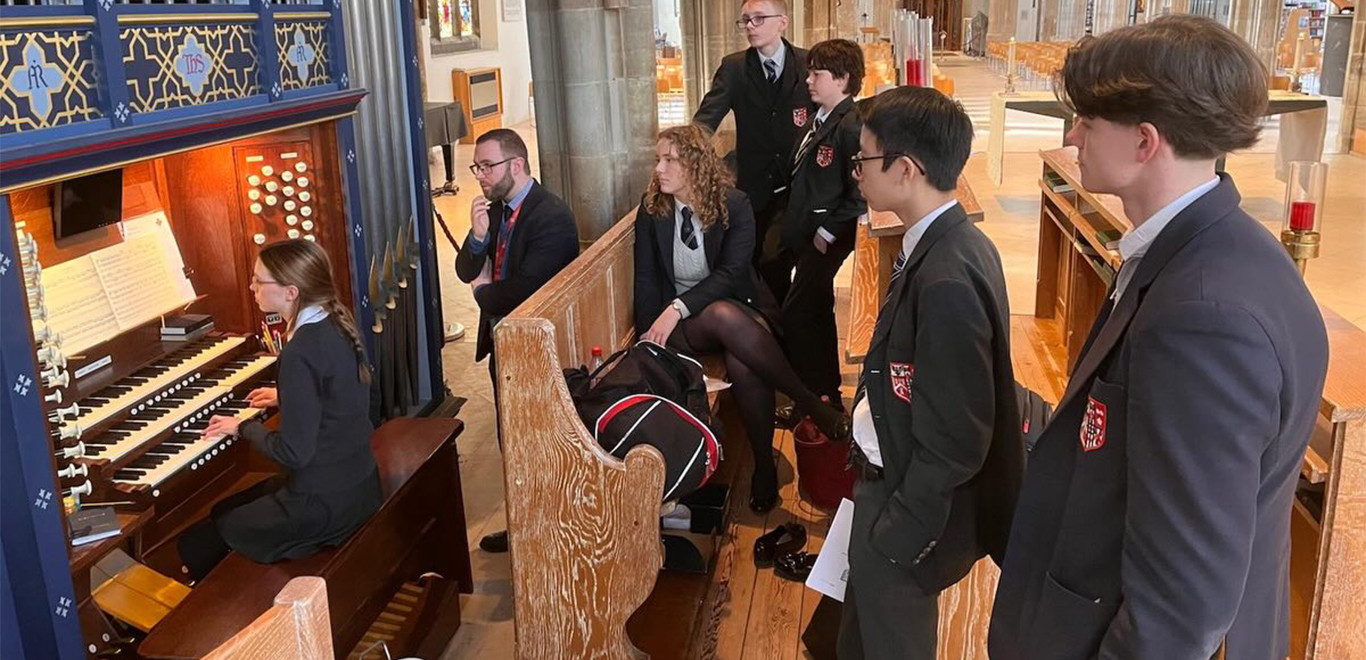 Brentwood students playing the Cathedral organ under the supervision of Samuel Bristow.